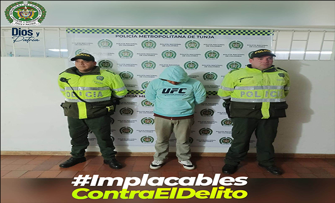 Persona capturada-policías custodiando