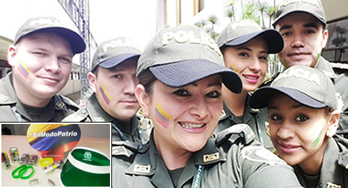 policia-pinta la cara-tricolor-patrio-SomosColombia